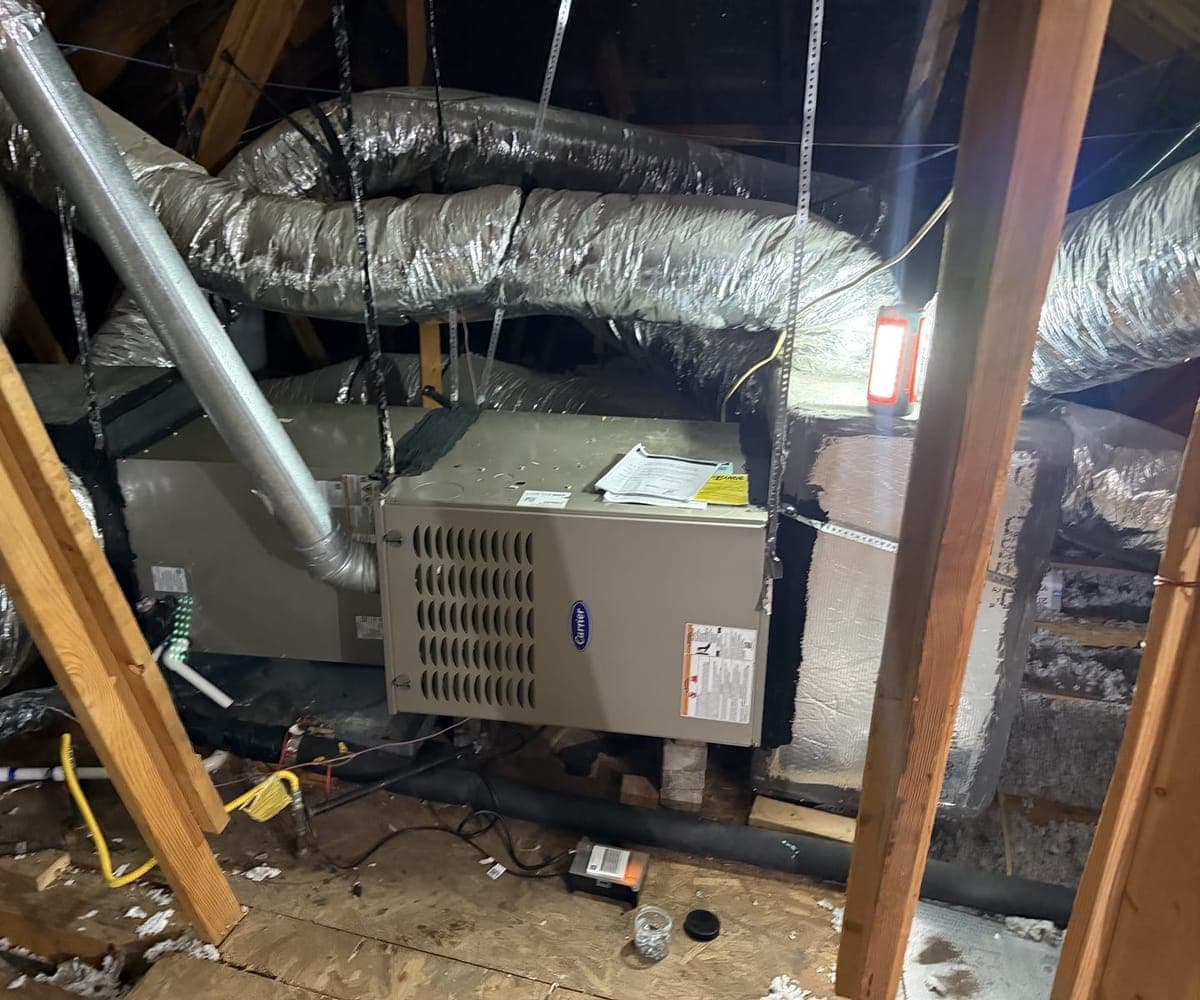 New Carrier indoor unit in an attic, connected to insulated flex ducts